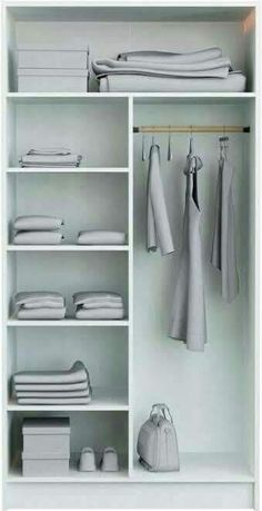 an organized closet with white clothes and accessories