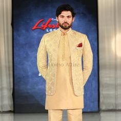 Open Front Golden Prince Coat Pakistan For Men | Prince Coat Pakistan Royal Gold Traditional Wear With Traditional Drape, Elegant Gold Nehru Jacket With Dabka Work, Luxury Gold Sherwani For Semi-formal Occasions, Elegant Gold Bandhgala For Designer Wear, Gold Elegant Bandhgala, Traditional Gold Outerwear For Winter, Gold Nehru Jacket With Dabka For Eid, Formal Long Sleeve Sherwani With Gold Embroidery, Gold Long Sleeve Kurta For Formal Occasions