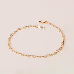 The Heart Link Chain Bracelet is the ultimate symbol of love and connection. This perfectly packaged and ready-to-gift chain is designed to capture hearts and make every moment special. This bracelet is available in three luxurious options: 14k gold filled, 14k rose gold filled, or sterling silver. The stunning chain features delicate heart-shaped chain links, symbolizing the everlasting bond between two souls. But this chain bracelet isn't just a gift. It's a heartfelt gesture, a reminder of th Heart Chain Bracelet, Symbol Of Love, Link Chain Bracelet, Month Gifts, Heart Chain, Chain Links, Chain Anklet, Love Symbols, Ankle Bracelets