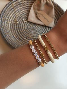 three bracelets with the word love written on them