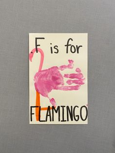 a flamingo handprint on a piece of paper that says f is for flamingo