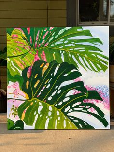 a painting of tropical leaves and pink flowers in front of a house