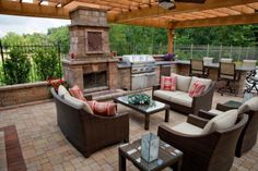 an outdoor living area with patio furniture and grill