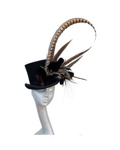 Beautiful Black Wool felt top hat trimmed with a black grosgrain hat band dressed with Black & Tan feathers and a long Lady amherst side pheasant feather making this a truly stunning statement piece. The hats maximum head size is 52cm. This can be made to in larger sizes  Made to Order 21 days  Delivery Please note:- Handmade in the United Kingdom Buyers outside of the UK  may need to pay customs fees or duties, which vary from country to country. Also, customs can sometimes delay delivery by ma Feather Making, Hat With Feather, Pheasant Feather, Wool Top, Large Hats, Pheasant Feathers, Hat Ideas, Wedding Hats, Hat Band