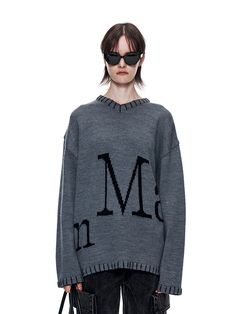 This product is a knitted sweater that combines timeless style with modern detailing. It is crafted to provide warmth and comfort while maintaining a chic and sophisticated appearance. The design features bold lettering across the front, adding an element of graphic interest. - This sweater is characterized by a large, stylized lettering across the front, giving it a contemporary and fashionable edge.- The ribbed neckline, cuffs, and hem offer a snug fit and contribute to the garment's classic look.- It's made with soft, high-quality yarn that ensures comfort and longevity, ideal for cooler weather.- The sweater's relaxed fit allows for easy layering over shirts or under jackets, making it a versatile piece for various outfits. Winter Knit Sweater With Letter Print, Winter Letter Print Knit Sweater, Modern Fall Sweater With Ribbed Cuffs, Modern Cotton Sweater For Winter, Modern Relaxed Fit Sweater For Fall, Oversized Modern Crew Neck Sweater, Modern Oversized Crew Neck Sweater, Modern Relaxed Fit Sweater For Winter, Modern Gray Winter Sweater