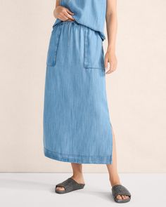 This indigo-dyed cargo skirt, fashioned from sustainable TENCEL™ fabric, has generous pockets, a drawstring waist, and side slits for ease of movement. The natural dye process makes each piece unique. Pairs beautifully with our matching chambray shirt. | This product’s overall fiber content is made with at least 50% of an environmentally preferred fiber. Learn more about our efforts to design planet-friendly apparel here. Details + Design: Hits at waist. Drawstring waist. Hits just above ankle. Utility Skirt With Elastic Waistband, Cotton Maxi Skirt With Drawstring And Relaxed Fit, Cotton Maxi Skirt With Drawstring, Cotton Long Skirt With Drawstring, Casual Maxi Skirt With Pockets In Medium Wash, Casual Relaxed Skirt With Slip Pockets, Casual Skirt With Slip Pockets And Relaxed Fit, Cargo Skirt, Chambray Shirt