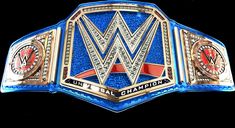 the wwe logo is shown on top of a blue and gold wrestling belt with red accents