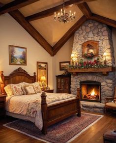 a bedroom with a stone fireplace in the corner and wooden furniture on the floor below