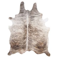 a white and brown cowhide rug on a white background