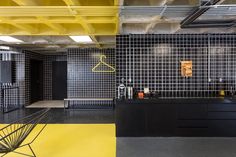 an empty room with yellow and black walls