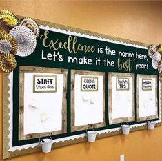 a bulletin board with three different quotes on it and some paper flowers hanging from the wall