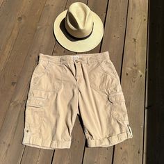 "Fantastic  pre-owned 90s khaki shorts with a comfortable relaxed fit.  Versatile Khaki beige colour, Several pockets, belt loops and a zipper and button closure   Size on tag is 10 - please check  measurements for accurate fit Measurements are taken  laid flat and doubled where needed Waist: 35\" Hip : 42\" Inseam : 10.5\" Length : 19.5\" Material: cotton 97%,  elastan 3% Brand: Jones New York Sport Condition: Very nice pre-owned, one side pocket as some fraying at edge, check photo." Spring Outdoor Cargo Knee-length Shorts, Spring Outdoor Cargo Shorts, Spring Outdoor Knee-length Cargo Shorts, Outdoor Cargo Pocket Bermuda Shorts, Outdoor Cargo Bermuda Shorts, Outdoor Cargo Style Shorts, Bermuda Cargo Shorts For Outdoor, Utility Bermuda Shorts In Cargo Style, Utility Cargo Style Bermuda Shorts