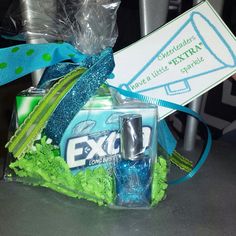 an exo gift bag with blue and green items in it, including a bottle of deodorant