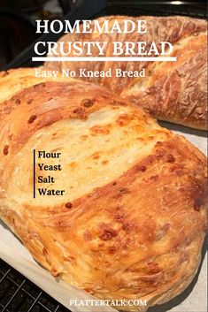 two loaves of bread sitting on top of a cooling rack