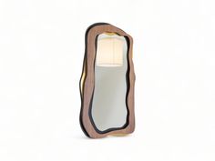 a wooden mirror with a white light on it's side and an oval shaped lamp in the middle