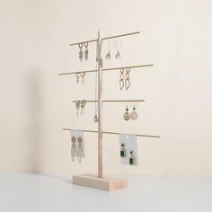 there is a jewelry rack with earrings on it