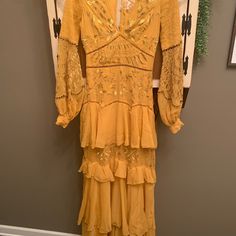 Beautiful Boho Dress With Bell Sleeves, Open Back, Embroidery, And Button Detail. Size 4, Never Worn. I Have Added A Picture Of Myself In The Size 2(Altered To A Midi Dress) Bohemian Lace Tiered Maxi Dress, Bohemian Embroidered Tiered Dress, Bohemian Midi Dress With Floral Embroidery For Party, Bohemian Fitted Tiered Midi Dress, Yellow Bohemian Tiered Dress, Bohemian Yellow Tiered Dress, Bohemian Tiered Party Dress, Bohemian Fitted Midi Dress With Floral Embroidery, Bohemian Fitted Embroidered Midi Dress