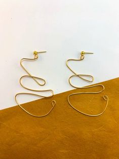 WAVY Abstract Wire Statement Earring Handmade | Etsy Minimalist Metal Wrap Earrings, Modern Wire Wrapped Earrings, Minimalist Handmade Metal Linear Earrings, Modern Wire Wrapped Drop Earrings, Minimalist Single Brass Wrap Earring, Modern Gold Dangle Wrap Earrings, Minimalist Metal Wrap Earrings Gift, Minimalist Gold Metal Wrap Earrings, Minimalist Gold Wire Wrapped Earrings