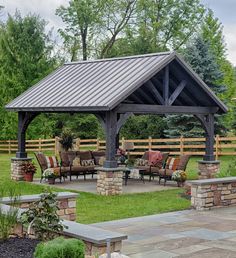 a covered patio with tables and chairs around it