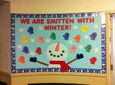 a bulletin board with an image of a snowman and the words we are smitten with winter