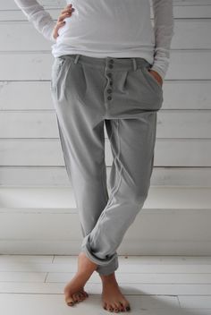 Relaxed Fit Button-up Solid Bottoms, Casual Gray Bottoms Solid Color, Casual Gray Plain Pants, Plain Gray Casual Pants, Everyday Gray Bottoms For Spring, Everyday Spring Gray Bottoms, Solid Button-up Pants With Pockets, Casual Baggy Bottoms With Button Closure, Casual Workwear Bottoms With Button Closure