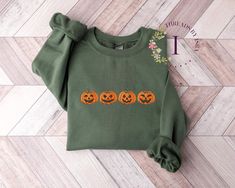 Embrace the Spirit of Spooky Season with Our Exquisite Embroidered Pumpkin Sweatshirt! 🎃🍂 As autumn leaves fall and Halloween approaches, there's no better way to celebrate than with our charming Embroidered Pumpkin Sweatshirt. This unique design captures the essence of fall with its meticulously crafted, high-quality thread embroidery. The embroidered pumpkin design measures a generous 1.6 x 6.8 inches, ensuring that every detail stands out beautifully. Why You'll Adore It: 🧵 Expert Craftsma Cavalier Spaniel, Jack O'lantern, Halloween Crewneck, Pumpkin Sweatshirts, Halloween Sweater, Sweatshirt Halloween, Pumpkin Shirt, Pumpkin Faces, Bichon Frise