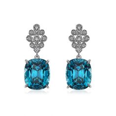 Suspended from an artful diamond floral pattern, it's easy to get swept away by these stunning, deep blue cushion cut Blue Zircon earrings. Blue Diamond-accented Evening Earrings, Luxury Blue Diamond Drop Earrings, Blue Diamond Drop Earrings For Formal Occasions, Blue Diamond Bridal Earrings For Formal Events, Blue Diamond Bridal Earrings For Formal Occasions, Exquisite Blue Earrings With Diamond Accents, Blue Diamond Earrings For Evening, Luxury Blue Diamond Earrings For Formal Events, Luxury Blue Diamond Earrings For Formal Occasions