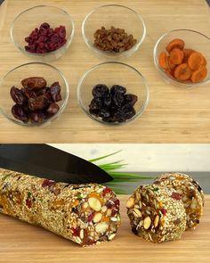 an assortment of nuts, raisins, and other foods on a cutting board