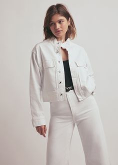 Enlist this oversized, military-inspired jacket into your wardrobe. The Nikki jacket is slightly cropped with patch pockets, stand up collar and a wide hem. The new comfort stretch denim has been stripped down and dyed to a milky white with natural texture and grit so the jacket keeps its structure but with a soft, worn-in touch.77% Cotton, 22% Lyocell, 1% SpandexCare Instructions:Machine wash cold gentle cycleLine dryZak is 5'8" wearing size Small White Shacket With Pockets For Work, White Utility Jacket With Flap Pockets For Work, White Utility Jacket With Button Closure For Work, White Cotton Shacket For Work, White Utility Outerwear With Pockets, Casual White Outerwear With Buttoned Pockets, White Utility Jacket With Pockets For Fall, Casual White Outerwear With Patch Pockets, Casual White Utility Jacket With Button Closure