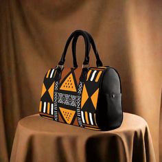 African Handbag with Ethnic Mud Cloth Pattern - Cultural & Stylish Traditional Brown Rectangular Weekender Bag, Traditional Satchel For Travel, Traditional Brown Satchel, Handmade Brown Travel Bag For Daily Use, Traditional Black Pouch Bag, Artisan Black Bag For Daily Use, Traditional Rectangular Satchel For Travel, Traditional Black Handheld Bag, Traditional Travel Bag With Top Carry Handle