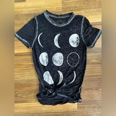 Size Xs Women’s Tee With The Moon Phases On The Front. Very Light Material. Back Is Longer Than The Front And The Material Is Semi See Through. I’ve Had The Tee With The Knot In The Front! Excellent Condition! Summer Moon Print Crew Neck Top, Trendy Moon Print Crew Neck Top, Trendy Crew Neck Top With Moon Print, Cotton Summer Tops With Moon Print, Casual Spring Tops With Moon Print, Casual Moon Print Tops For Spring, Summer Short Sleeve Top With Moon Print, Casual Crew Neck Top With Moon Print, Fitted Moon Print Tops For Summer