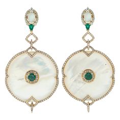 Handcrafted entirely from 18-karat gold, this stunning earrings is set with 50.15 carats mother of pearl, 1.55 carats emerald and 2.69 carats of glimmering diamonds. FOLLOW MEGHNA JEWELS storefront to view the latest collection & exclusive pieces. Meghna Jewels is proudly rated as a Top Seller on 1stDibs with 5 star customer reviews. All items manufactured by us are handmade and can be customized or redesigned. Composition Size-70X36 Total Weight-27.3 Gold Weight(Gms)-16.422 Diamond Wt(Cts)-2.69 Emerald Wt(Cts)-1.55 Mother of Pearl Wt(Cts)-50.15 Pearl Dangle Earrings, Diamond Dangle Earrings, Yellow Gold Jewelry, White Gold Earrings, Pearl Earrings Dangle, Yellow Gold Earring, Pearl Diamond, Diamond Drop Earrings, Dream Jewelry