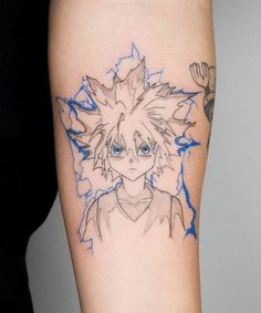 a person with a tattoo on their arm that has an anime character drawn on it