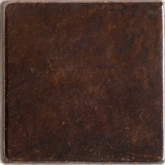 an old brown square tile on a white background