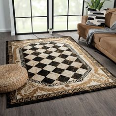 a living room filled with furniture and a checkered rug