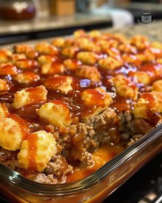 a casserole dish filled with meat and sauce