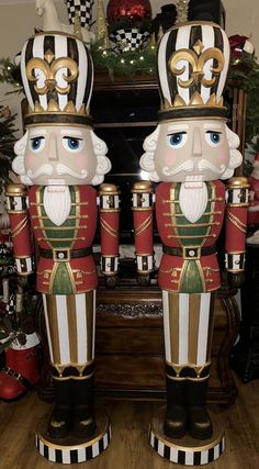 two nutcrackers are standing next to each other