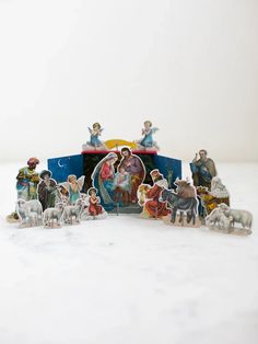 a nativity scene with figurines on top of it