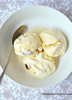 two scoops of ice cream in a white bowl