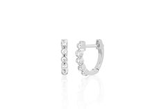 With a row of five glistening bezel diamonds, this miniature huggie earring brings sparkling flair to any ensemble. It features 0.09 carats of diamond set in your choice of gleaming 14k yellow, rose, or white gold. Diameter measures: 9.5mm White Gold Huggie Earrings With Bezel Setting, Classic Bezel Setting Huggie Earrings, Classic Huggie Earrings With Bezel Setting, Diamond Bezel Huggie Earrings, Diamond Huggie Earrings With Bezel Setting For Anniversary, Diamond Huggie Earrings With Bezel Setting, Round Diamond Huggie Earrings With Bezel Setting, Diamond Hoop Earrings With Bezel Setting For Anniversary, Elegant Round Huggie Earrings With Bezel Setting