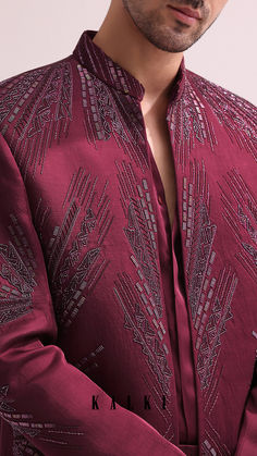 Experience a blend of contemporary style and timeless traditions with our maroon Jodhpuri ensemble. Featuring a hand embellished open bandhgala with glistening cutdana accents. Fabricated from luxurious linen satin.
this expertly crafted outfit is complemented with a chinese collar shirt and co-ordinating straight pants. Chinese Collar Shirt, India Fashion Men, Mens Party Wear, Jodhpuri Suit, Hijab Designs, Guy Style, Satin Hands, Moroccan Interiors, Chinese Collar