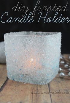 diy frosted candle holder on a wooden table