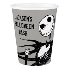 a paper cup with a cartoon character on the front and bottom, in black and white