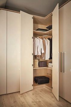 an open closet with clothes and other items