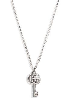 The emblematic double-G tops a key pendant with a flowing arabesque design on this bold chain-link necklace. Style Name:Gucci Gg Silver Key Necklace. Style Number: 6134022. Gucci Sterling Silver Chain Jewelry, Engraved Silver Gucci Necklace, Classic Silver Gucci Necklaces, Elegant Gucci Chain Necklace, Gucci Classic Pendant Jewelry, Classic Gucci White Gold Necklace, Elegant Gucci Chain Link Jewelry, Classic Gucci Chain Jewelry, Gucci White Gold Chain Jewelry