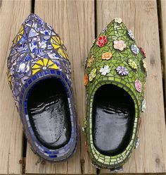 a pair of colorful shoes sitting on top of a wooden floor next to each other