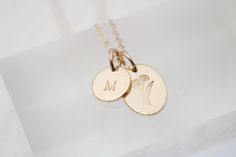 Surprise your loved one with our Birth Flower Necklace! Each delicate necklace is adorned with their special birth flower and comes with a personalized initial disc. Perfect for birthdays or as a thoughtful bridesmaids gift. Available in 14k gold filled or sterling silver. Comes with a beautiful printed card revealing the unique meaning behind each flower. D E T A I L S 14k Gold Filled or Sterling Silver Oval Measures 1/2" and Tiny Initial Charm Measures 3/8" Includes adjustable 16-18" Dainty Cable Chain Stamped by Hand Hypoallergenic and Nickel Free Handcrafted in Ohio Elegant Birth Flower Charm Necklaces For Personalized Gift, Elegant Charm Necklaces With Birth Flower For Personalized Gift, Delicate Yellow Gold Birth Flower Charm Necklaces, Delicate Yellow Gold Charm Necklace With Birth Flower, Delicate Yellow Gold Birth Flower Charm Necklace, Minimalist Wedding Charm Necklace With Flower Charm, Minimalist Wedding Flower Charm Necklace, Personalized Gold Jewelry With Pressed Flowers, Delicate Birth Flower Charm Necklace For Wedding