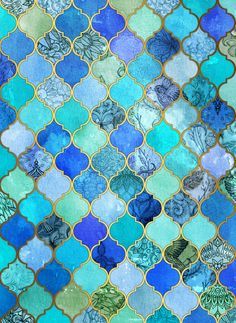 an abstract blue and green mosaic tile pattern with gold trimmings on the edges