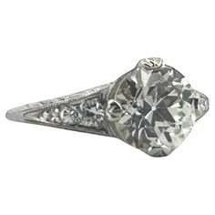 an old cut diamond ring with filigrees