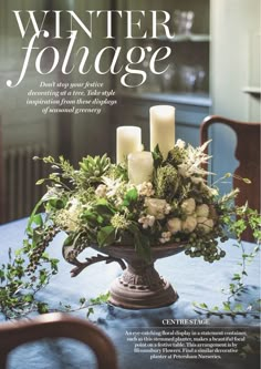 a magazine cover with candles and flowers on the table in front of an ornate vase